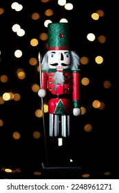 Christmas nutcracker with Christmas tree in background