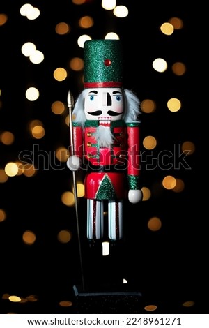 Christmas nutcracker with Christmas tree in background