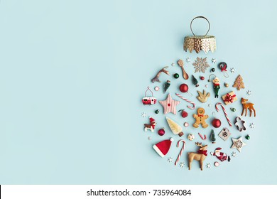 Christmas objects laid out in the shape of a Christmas bauble, overhead view - Shutterstock ID 735964084