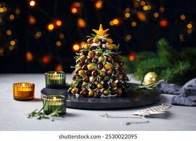 Christmas olives, cream cheese tree, creative side dish, table decoration. Close up. Copy space. Dark background. - Powered by Shutterstock