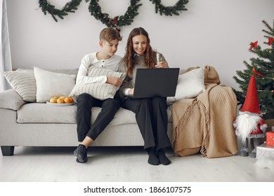 Christmas online. Celebration X-mas new year in lockdown coronavirus quarantine. Party online. Mother with son. - Shutterstock ID 1866107575