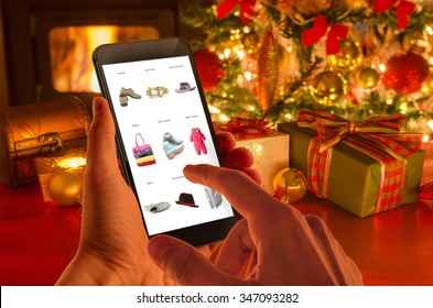 Christmas online shopping with phone. Christmas tree, gifts, lights and decorations.