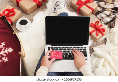 Christmas Online Shopping. Woman Buying Presents For Xmas On Laptop With Credit Card, Copy Space On Screen