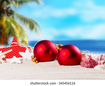 Christmas Ornament On A Beach,concept Of A Warm, Tropical Weather Christmas