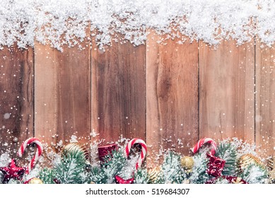 Christmas Ornaments With Snow On Wood Background, Top View, Border Design