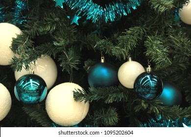 Christmas Ornaments In Teal And Pastel Blue Colors In A Christmas Retail Shop