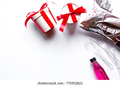 Christmas Packaging And Food Delivery, Boxes With A Red Bow, Juice, Plastic Spoon, Forks And Knife On The White Background Flat Lay