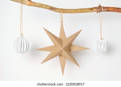 Christmas Paper Star and Ball Decoration. Handmade Christmas Nordic Decor on a Light Background against the Wall. Boho, Scandinavian Style Design. DIY. Minimal Ornament. Structural Origami. Zero Waste - Powered by Shutterstock