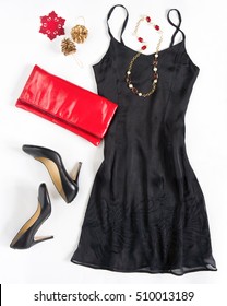 Christmas Party Outfi. Cocktail Dress Outfit, Night Out Look On White Background. Little Black Dress, Red Evening Clutch , Black Shoes, Red Ang Gold Necklace. Flat Lay, Top View