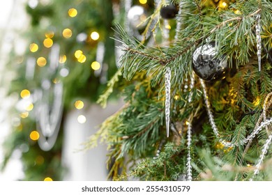 A Christmas photo featuring a snow globe with an icicle, a gift, and blurred background with garlands., warm, festive spirit of New Year holidays. - Powered by Shutterstock