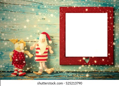 Christmas Photo Frame Card, Santa Claus And Reindeer Rag Dolls And Empty Photo Frame With Heart , Vintage Tone Wooden Background