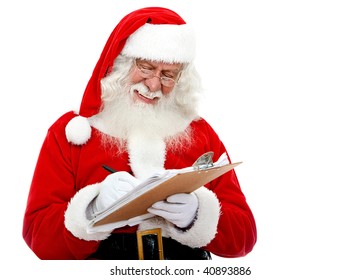 Christmas Portrait Of Santa Claus Writing A List Isolated Over A White Background