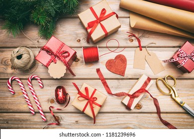 Christmas Preparation. Gift Boxes Wrapping On Wooden Background, Top View