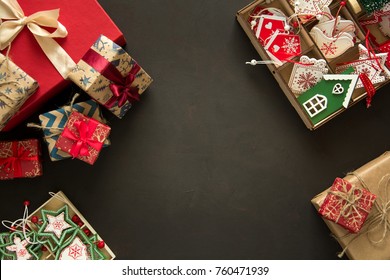 Christmas Present Boxes And Box With Wooden Toys On Brown Background. Top View. Flat Lay