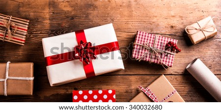 Similar – Image, Stock Photo Christmas gift boxes pattern and red star christmas shopping