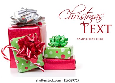 Christmas presents stacked up on white background - Powered by Shutterstock