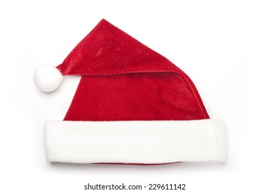 A Christmas Red Hat For Gift Isolated White, Top View At The Studio.