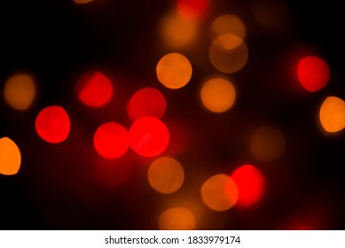 Christmas Red And Orange Bokeh On The Black Background