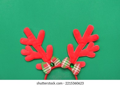 Christmas Reindeer Horns On Green Background