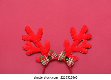 Christmas Reindeer Horns On Red Background