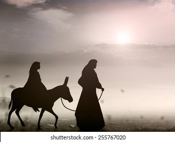 Christmas Religious Nativity Concept: Mary And Joseph With A Donkey