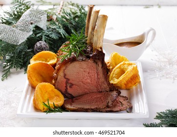 Christmas roast beef with Yorkshire pudding. Festive dinner.