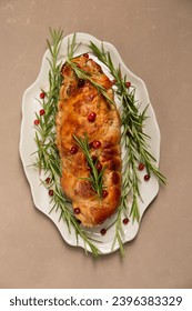 Christmas roll of turkey fillet stuffed with mushrooms and cheese with cranberries and rosemary - Shutterstock ID 2396383329