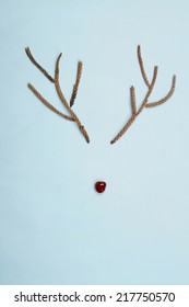 Christmas Rudolf Reindeer Rustic Antlers And Cherry Nose On Blue