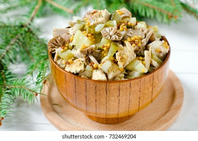 Christmas salad from chicken, potatoes, marinated mushrooms and pickles with parchment from Dijon mustard - Powered by Shutterstock