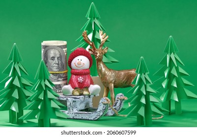 Christmas Scene. Money Christmas Gift On Wooden Sled. Green Origami Fir Tree On A Green Background. Christmas Tree Paper Cutting Design Card. New Year Background With Paper Fir Tree. Paper Craft