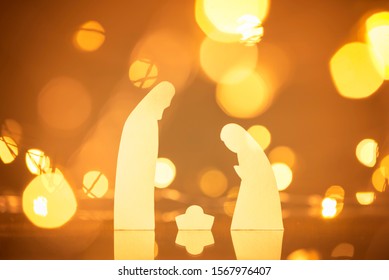 Christmas Scene With Paper Manger And Background With Lights