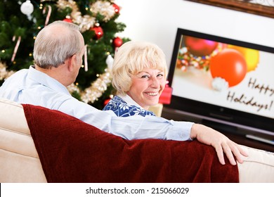 Christmas: Senior Couple Watches Holiday Shows On TV