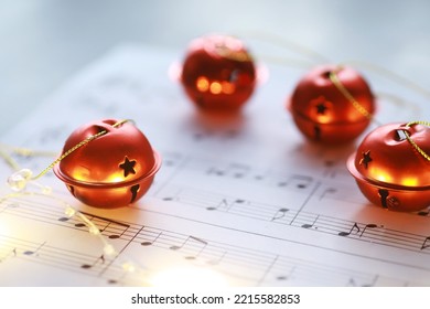 Christmas Sheet Music. Christmas Decorations On Music Sheets, Closeup

