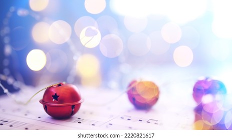 Christmas Sheet Music. Christmas Decorations On Music Sheets, Closeup

