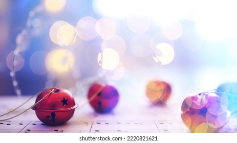 Christmas Sheet Music. Christmas Decorations On Music Sheets, Closeup

