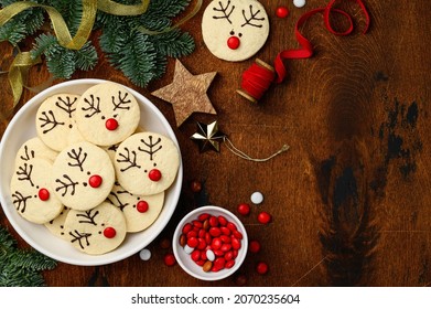 Christmas shortbread  cookies reindeer Rudolph on a white plate. Children's festive dessert. Top view, copy space.  - Powered by Shutterstock