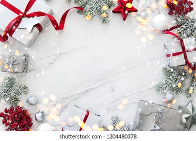Christmas silver handmade gift boxes on white marble background top view. Merry Christmas greeting card, frame. Winter xmas holiday theme. Happy New Year. Flat lay - Shutterstock ID 1204480378
