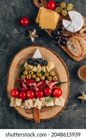 Christmas Snack Tree On Dark Concrete Background. Cheese Plate. Christmas Food Concept. Top View