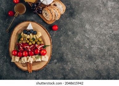 Christmas Snack Tree On Dark Concrete Background. Cheese Plate. Christmas Food Concept. Top View