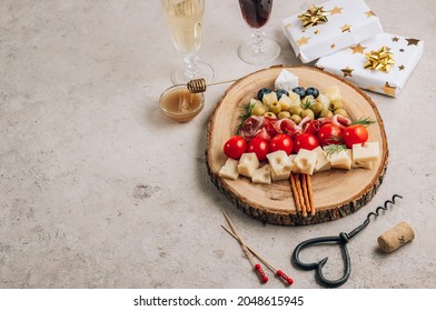 Christmas Snack Tree On Rustic Wooden Board Over Stone Background. Cheese Plate. Christmas Food Concept.