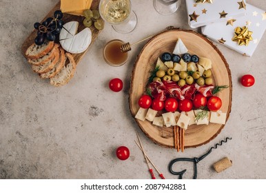 Christmas Snack Tree On Rustic Wooden Board Over Beige Stone Background. Cheese Plate. Christmas Food Concept. Top View With Plate For Text