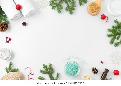 Christmas Spa Concept And Winter Skin Care Products, Fir Branches And Snowflakes On White Background, Flat Lay, Copy Space.  Seasonal Beauty Routine And Body Care Concept.