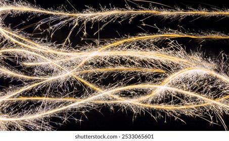 Christmas sparklers abstract light trails on black background. - Powered by Shutterstock