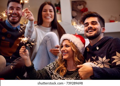 Christmas Sparklers-happy Friends Enjoying Party On Christmas
