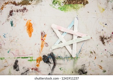 Christmas star made and wooden sticks  Children's craft  Graffiti 