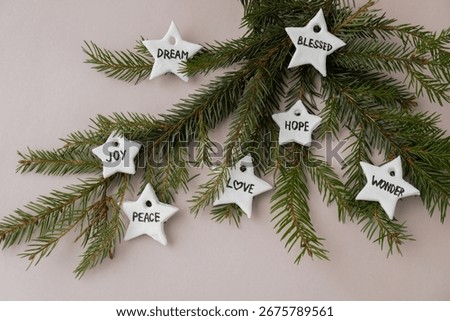 Christmas star with words RISEN BLESSED HOPE JOY PEACE DREAM LOVE WONDER White air dry clay for making decor to Christmas tree holiday. Creating hobby recreation activity that involves fingers. DIY