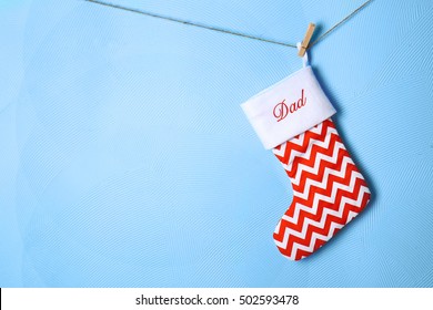 Christmas Stocking Hanging Against Blue Background