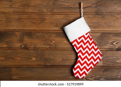 Christmas Stocking Hanging Against Wooden Wall