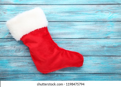 Christmas Stocking On Blue Wooden Table