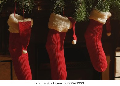 Christmas stockings hanging over fireplace.  - Powered by Shutterstock